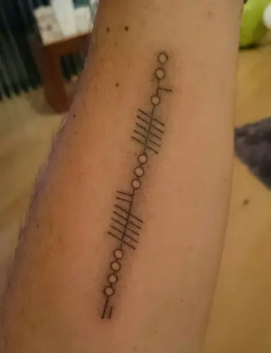 Ogham tattoo —  on wrist