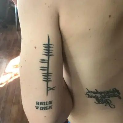 Ogham tattoo —  on shoulder