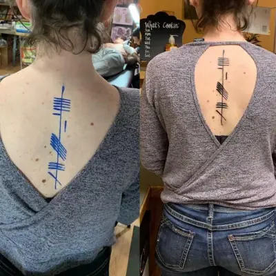 Ogham tattoo —  on spine
