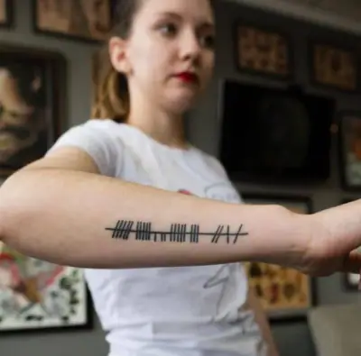 Ogham tattoo —  on wrist