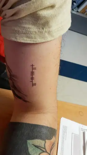 Ogham tattoo —  on arm
