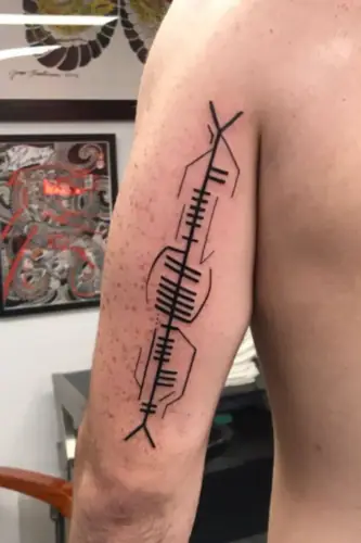 Ogham tattoo —  on arm