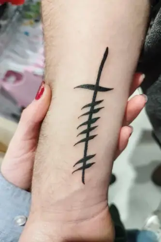 Ogham tattoo —  on wrist